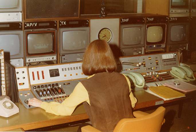 A shot of the MCR at ATV Centre, with Assistant Transmission Controller Anna McKenna, from the mid 70s. Note the two scr...